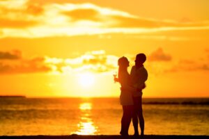 couple on beach at sunset